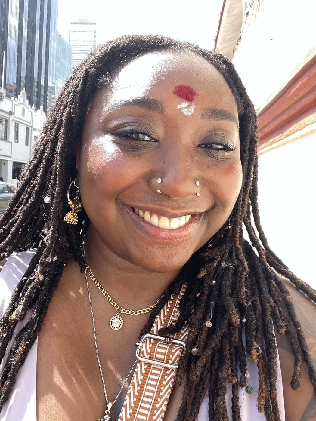 Ashleigh smiling, with a bindi and nose ring