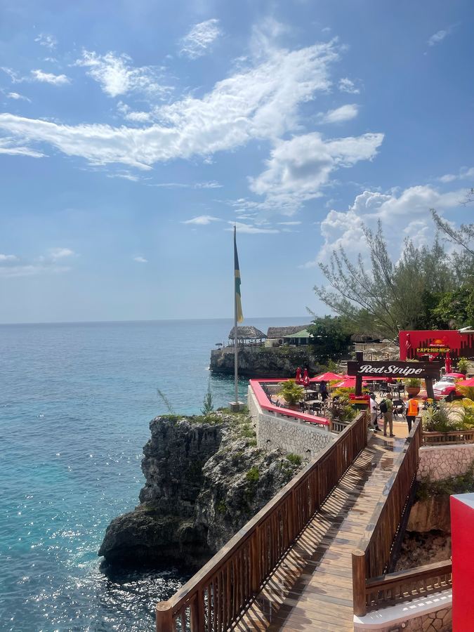 A wooden walkway down to cliffs above the sea