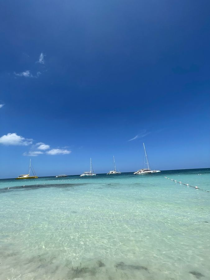 Sailboats moored on calm turquoise water